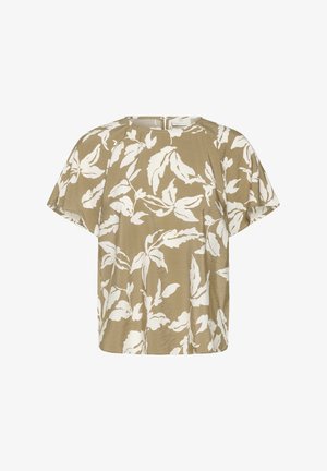 Blouse beige à manches courtes avec motif floral blanc et col rond, fermeture éclair dans le dos.