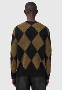 Donker groen en zwart diamantpatroon trui met een zachte, textuurafwerking. Rib gebreide mouwen en onderkant, ronde hals en een losse pasvorm.