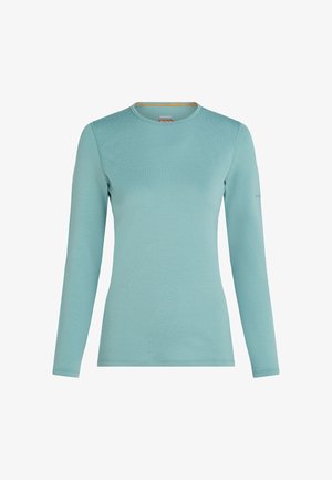 Långärmad T-shirt med rund hals i ljus teal, tillverkad av mjukt och lätt material, framifrån med synlig sömnad längs sömmarna.