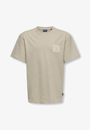 T-shirt beige en coton à manches courtes avec col rond et petit motif blanc sur le thème du surf sur le côté gauche de la poitrine.