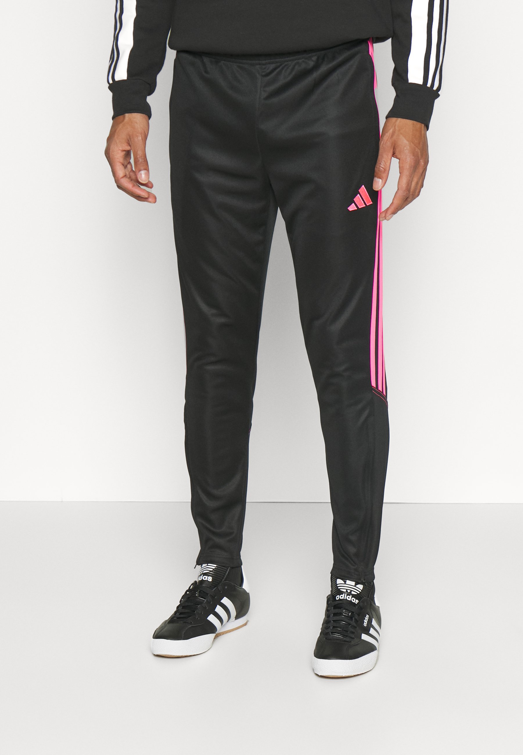 pink and black adidas track pants
