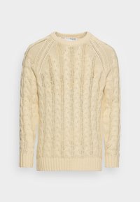 Kremowy sweter w warkoczowy splot z okrągłym dekoltem, długimi rękawami oraz ściągaczami przy mankietach i dole. Charakteryzuje się teksturowanym, tkanym wzorem na całej powierzchni.