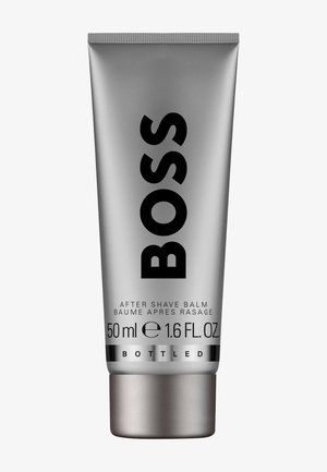 Silberne Tube BOSS Aftershave-Balsam mit schwarzem Text, 50 ml (1,6 fl oz) Fassungsvermögen und Schraubverschluss.