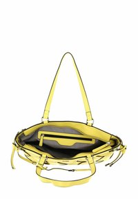 Sac à main en cuir jaune avec un intérieur spacieux, doté d'une doublure en tissu rayé, de plusieurs compartiments et de bretelles d'épaule durables.