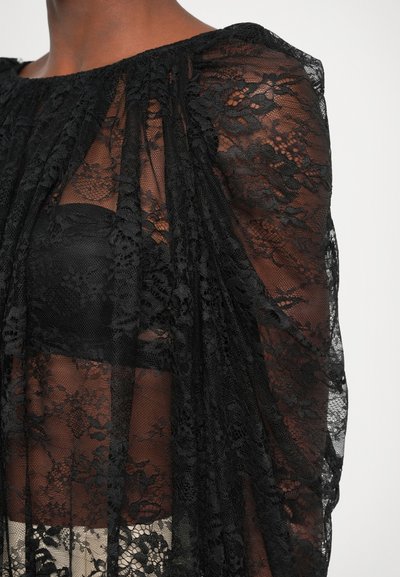 Must mustriga Pilates püsiv ja voolav disain,nelge ämbrilahti mustal batis(te) kihi(t)e all.'