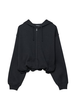 Felpa nera corta in tessuto morbido, con cerniera frontale, cappuccio con coulisse e polsini a coste con orlo inferiore arricciato.