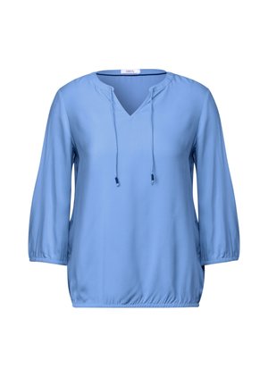 Blusa azzurro chiaro con maniche a tre quarti, scollo a V, coulisse al collo e orlo arricciato per una vestibilità rilassata; tessuto leggermente testurizzato.