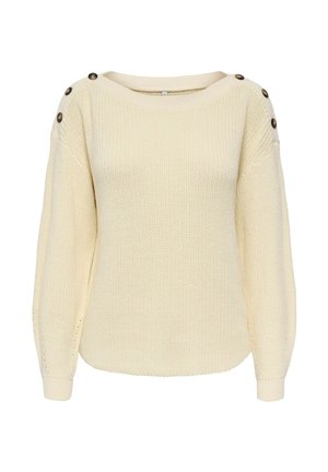 Pull tricoté couleur crème avec manches longues et trois boutons foncés sur chaque épaule.