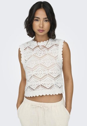 Top scurt, tricotat, alb, fără mâneci, cu un model de dantelă hexagonală și margini fanteziste. Dispune de un finisaj texturat și un design ușor.