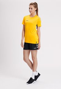 Hummel TECH MOVE - T-Shirt print - yellow