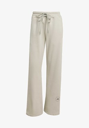 Beige sweatpants met wijde pijpen, een elastische tailleband, een aantrekkoord aan de voorkant en een discreet logo vlak bij de linker enkel.