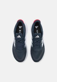 Navy blue athletic shoes with white three-stripe design, breathable mesh upper, and cushioned sole. Red accents on the heel collar.