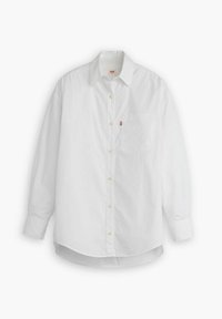 Camisa blanca de manga larga de algodón, con cierre de botones en la parte delantera, bolsillo en el pecho y dobladillo curvado. Incluye un pequeño logotipo en el bolsillo.