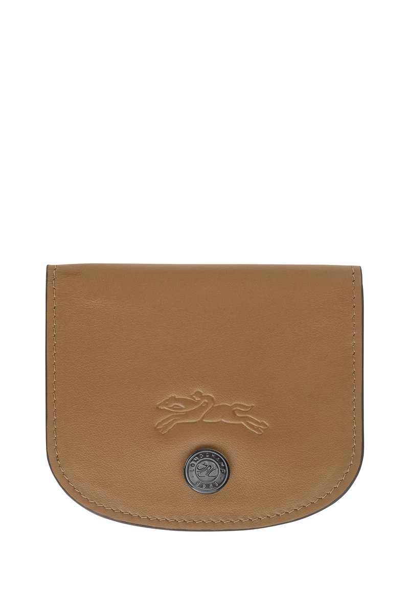 Tan leather wallet with rounded edges, embossed logo of a leaping animal, and circular metal hardware detail at the bottom center.