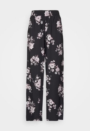 Schwarze Hose mit weitem Bein, weißem und hellrosa Blumenmuster und elastischem Bund vor einfarbigem Hintergrund.