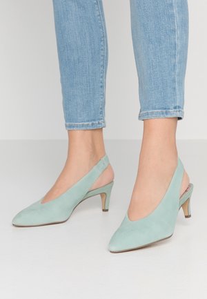 Mintgrønne ruskinds-slingback hæle med spidse tæer og 5 cm høje hæle. Glat tekstur, minimalistisk design og uden synlige metaldele.
