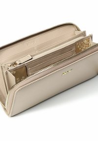 Beige leather wallet with zip closure, multiple card slots, and a patterned interior. Features a smooth texture and subtle branding detail.