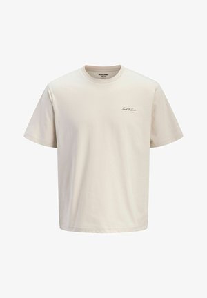 Beež lühikeste varrukatega ümara kaelusega t-särk, millel on vasakul rinnal väike must tekst "Jack & Jones Archive Selection".