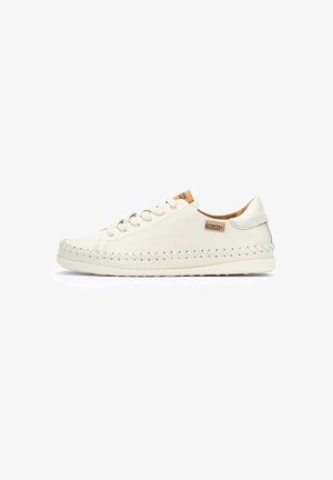 White leather sneaker with woven detailing along the sole, gray accents on the heel, and brown logo patch on the side. Lace-up design.