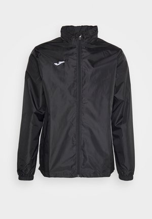 Black windbreaker jacket, lightweight material, front zipper, high collar, elastic cuffs, featuring a small white logo on the chest.
