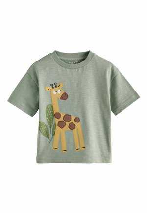 Roheline lühikeste varrukatega T-särk, millel on kollaselt tikitud kaelkirjak ja lehed. Omab ümmargust kaelust ning pehme tekstiiliga kangast.