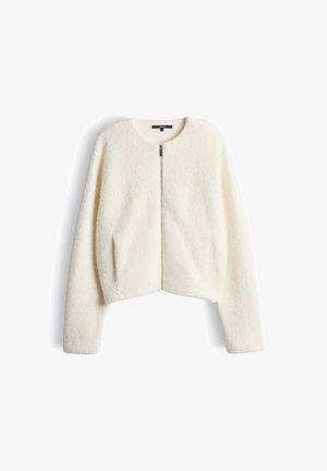 Cream-colored cropped jacket made of soft, fuzzy fabric. Features a round neckline and a full front zipper. Long sleeves, no visible hardware.