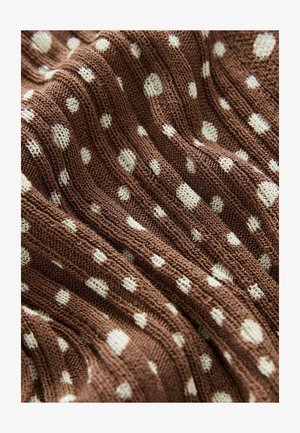 Brown knit fabric featuring white polka dots in various sizes, with a textured surface and ribbed design throughout.