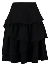 Svart, lager-på-lager kjol i smidig tyg. Har flera volanglager och en åtsittande midja som ger en luftig silhuett.