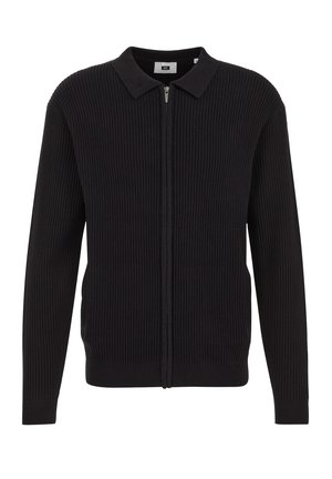 Suéter negro de punto acanalado con cremallera frontal, cuello y mangas largas. Textura suave y diseño ajustado con forma alargada.