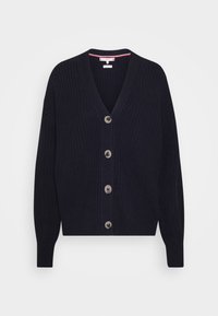 Námořnický pletený cardigan s výstřihem do V, pěti velkými knoflíky, žebrovanými manžetami a spodním lemem. Obsahuje pruhované vnitřní lemování. Měkká textura a uvolněný střih.