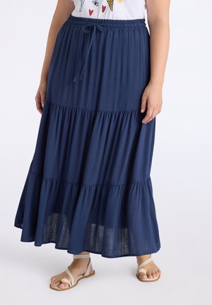 Jupe maxi bleue marine à volants en tissu léger, avec une taille élastique et un cordon de serrage, ainsi qu'un ourlet fluide.