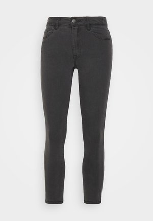 Jeans skinny de denim preto com cintura média, design de cinco bolsos e textura suave. Apresenta um fecho frontal com botão e zip.