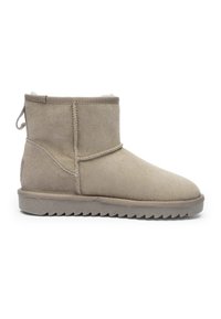 Beige suede ankle boot with fleece lining, flat ridged sole, side stitching detail, and pull tab at the back on a white background.