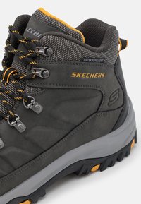 Skechers Stivaletti stringati - grey