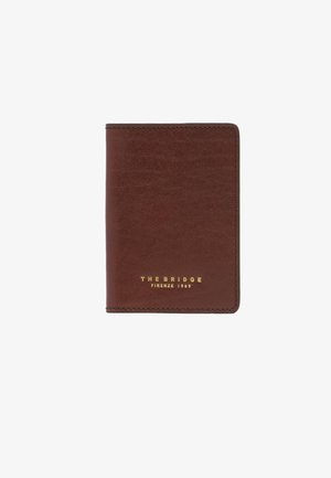 Portefeuille en cuir marron avec coins arrondis et "THE BRIDGE FIRENZE 1969" embossé en or sur le devant, centré sur fond blanc.