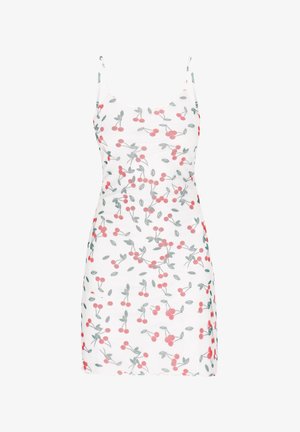 Valkoinen mekko, jossa on punaisia ja vihreitä kirsikkakuvioita. Suunniteltu ohuilla olkaimilla ja vartalonmyötäisellä siluetilla, siinä on aallotettu helma.