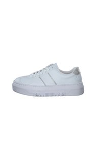 White sneaker with smooth synthetic material, round toe, flat laces, silver accents on the heel, and textured rubber sole with ridges.