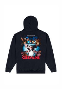 Černá mikina s kapucí s barevným grafikou "Gremlins" na zádech, zobrazující postavy s bílým textem nad obrázkem a červeným nápisem pod ním.