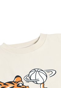 Bež kapuutsärk ümmarguse kaelusega, millel on oranž tiigri graafika koos korvpalli ja planeedi kujutisega. Sile puuvillane kangas.