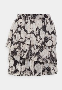 Jupe noire à volants avec des couches superposées, ornée d'un motif floral aux tons clairs et de pois blancs. Tissu léger et transparent.