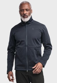 Dark blue softshell jacket with stand-up collar, zip closure, and two front zip pockets; features a sleek, fitted design.