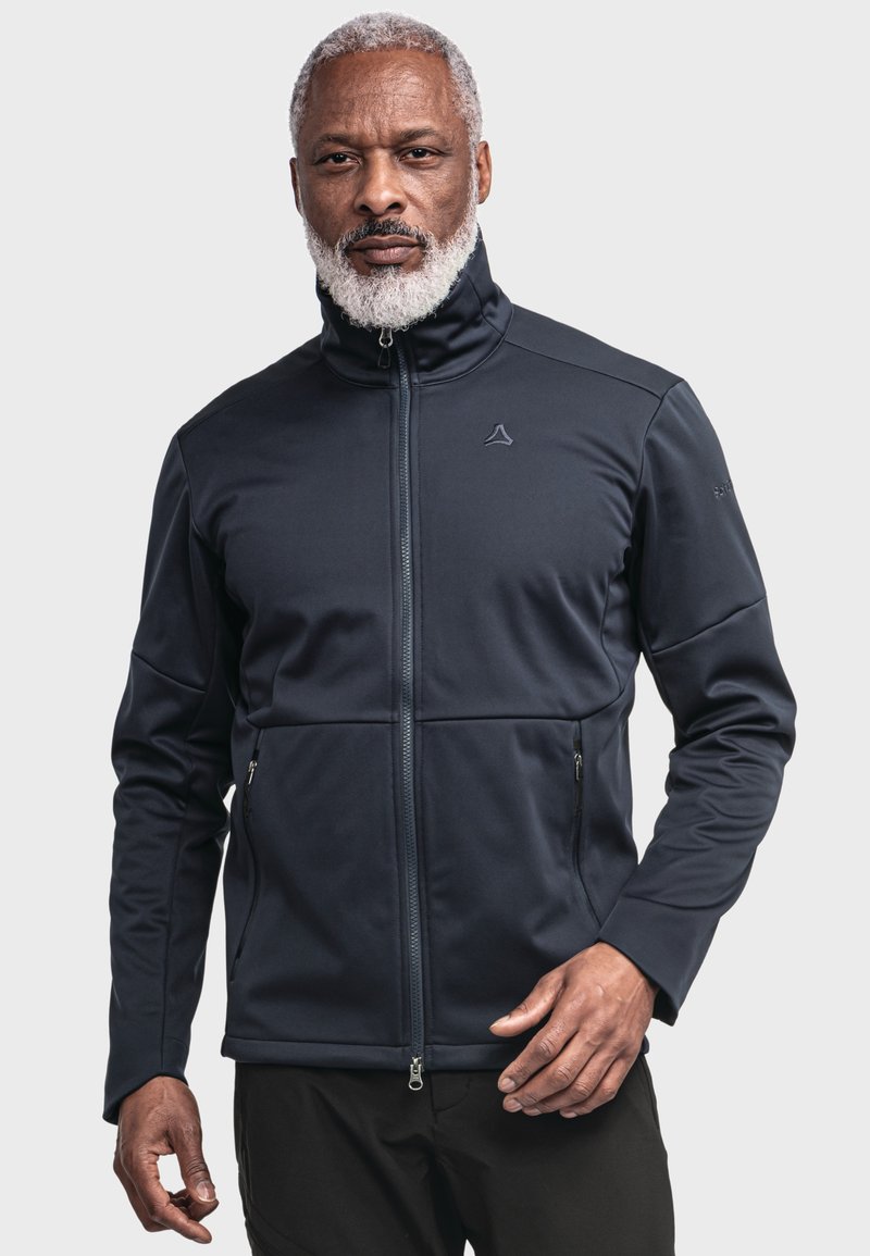 Dark blue softshell jacket with stand-up collar, zip closure, and two front zip pockets; features a sleek, fitted design.