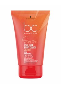 Roter Kunststoffbehälter von Schwarzkopf Bonacure Sun Protect Scalp, Hair & Body Cleanse. Mit weißem Text, Klappdeckel und Hinweis auf Kokosnussduft.