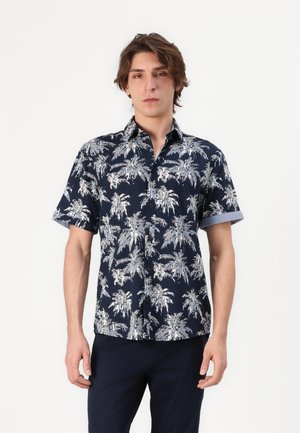 Short-sleeve shirt in navy fabric featuring white palm tree patterns, button-down collar, and rolled cuffs. Smooth texture and casual fit.