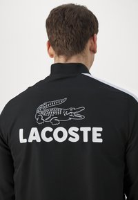 Lacoste Sport TRACKSUIT - Tuta - noir/blanc