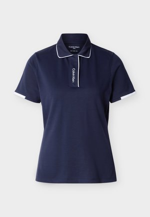 Granatowa koszulka polo z krótkim rękawem, z białą lamówką na kołnierzyku i rękawach, z pionowym logo "Calvin Klein" na przednim klinie.