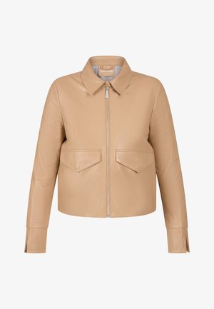 Beige leather cropped jacket with a pointed collar, front zip closure, and two chest pockets. Features stitched detailing and straight sleeves.