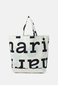 Sac fourre-tout en tissu crème avec de grandes lettres noires et des motifs abstraits vert menthe. Deux poignées solides pour le transport. Design spacieux.