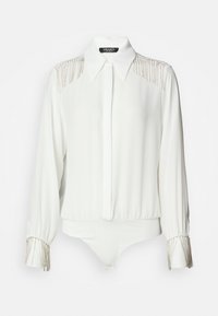 Body bianco a maniche lunghe con colletto, spalle decorate e polsini con accenti di perline metalliche. Tessuto morbido e fluido.