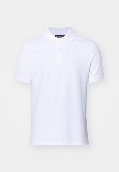 Bela polo majica iz bombaža, z dvema gumboma na izrezovanju, kratkimi rokavi in subtilnim logotipom na prsih.